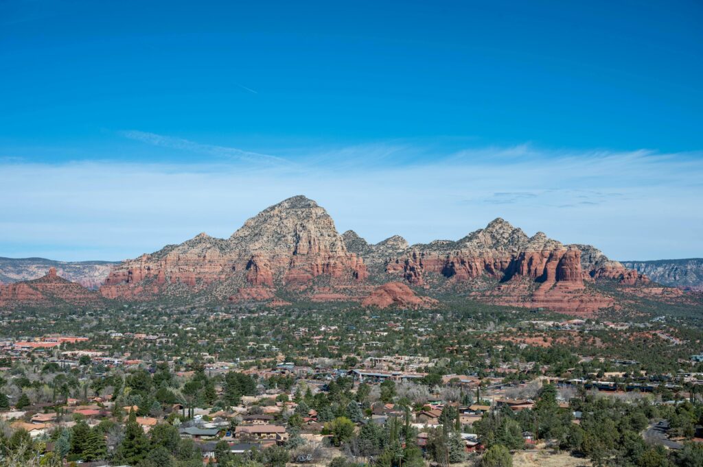 Scenic view of Sedona's stunning red rock formations under a clear blue sky.
