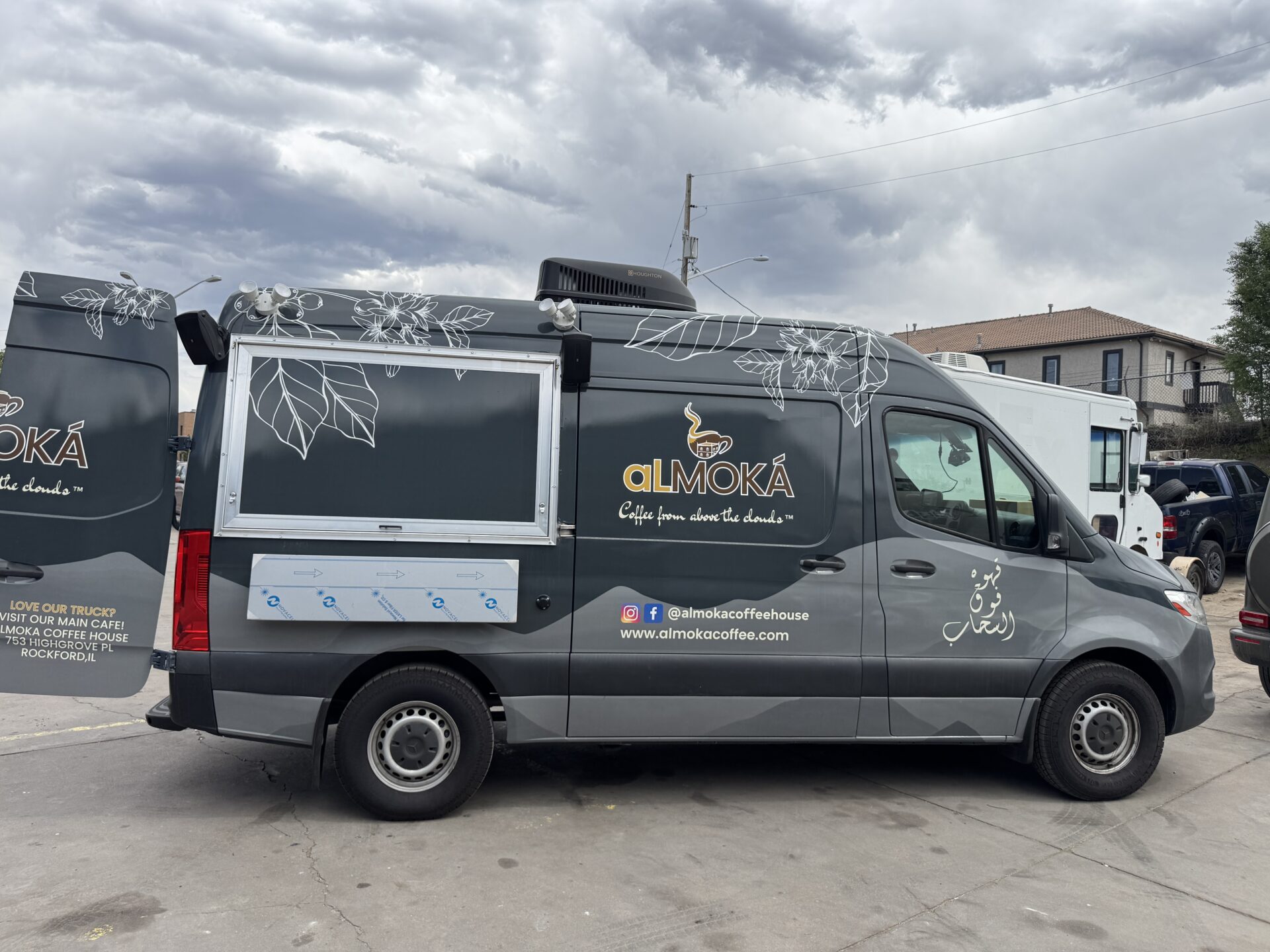 alMOKA coffee Sprinter van with rear doors showing the Rockford Illinois brick and mortar cafe address