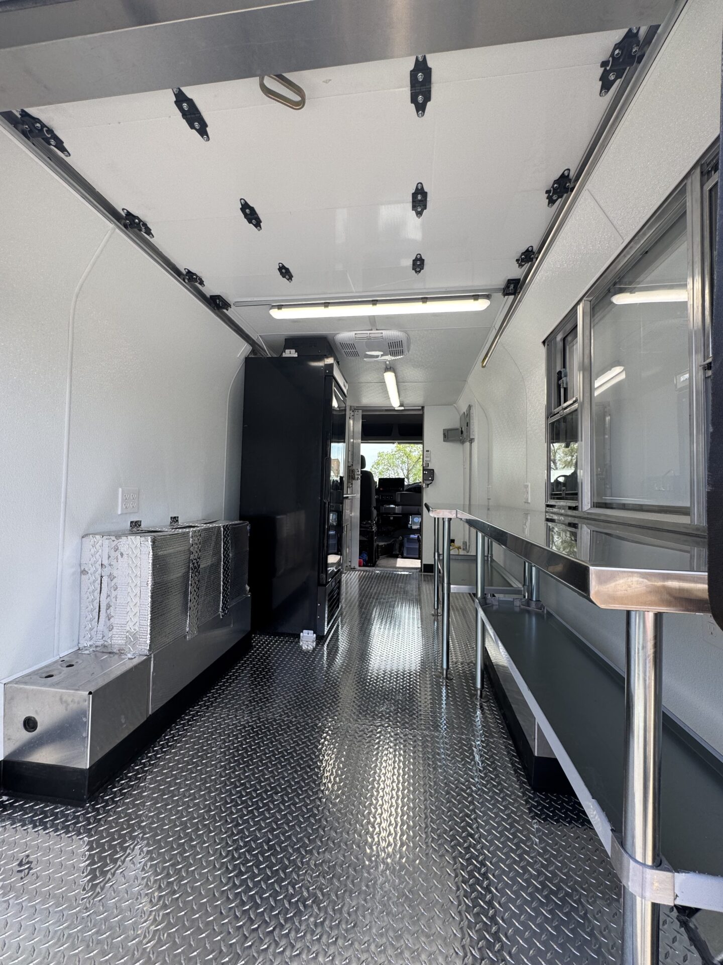 Stainless steel interior and cook line of a custom food truck built by Zion Foodtrucks