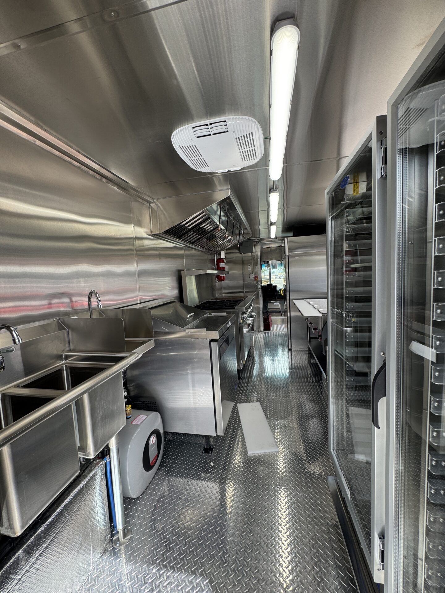 Stainless steel interior and cooking line of a custom food truck built by Zion Foodtrucks