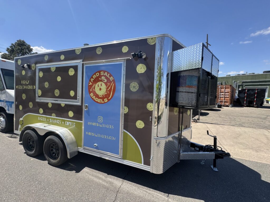 Yard sale bagels trailer side branding bozeman mt