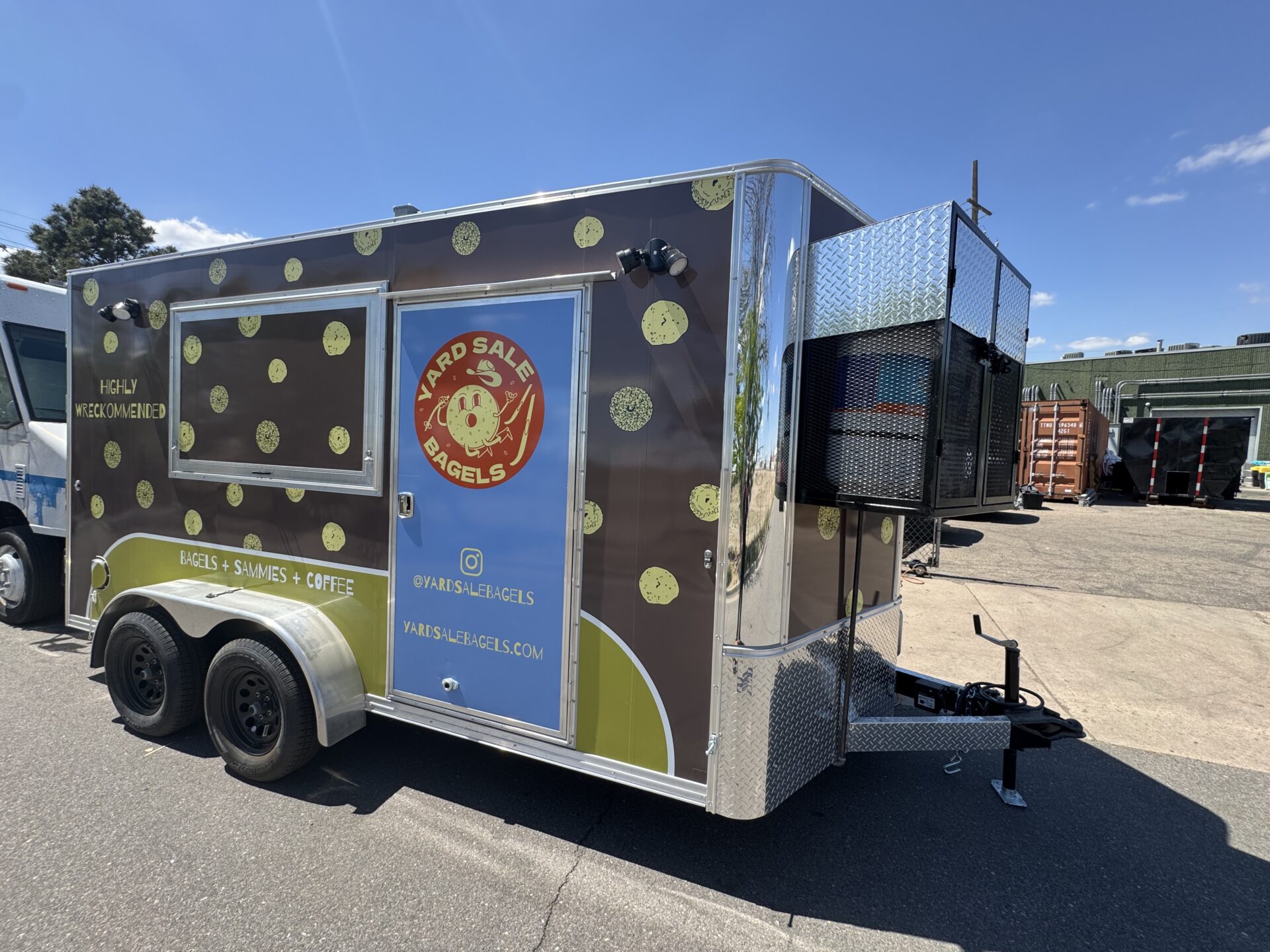 Yard Sale Bagels 14ft bagel food trailer with brown wrap and bagel pattern, parked outside ready for delivery to Bozeman Montana