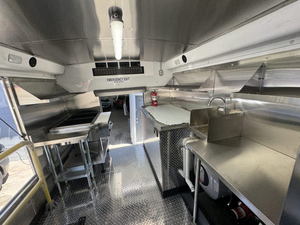 Stainless counters and sink inside the food bus