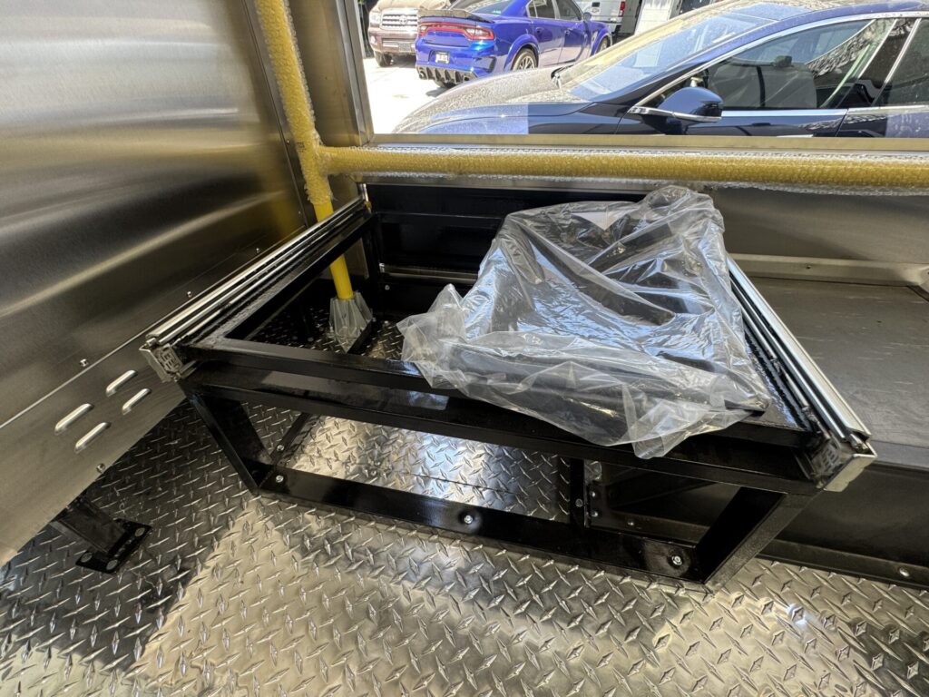 Custom sliding tray for hot holding inside the food bus