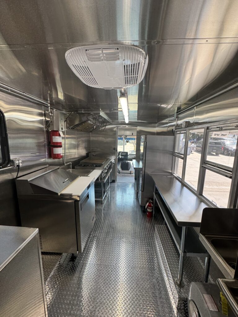 Interior of the catering truck showing cold storage and prep