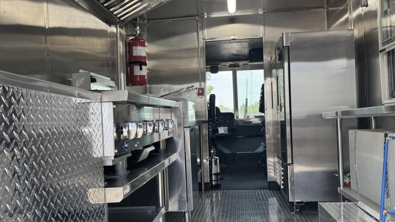 Food truck cook line with griddle, fryer and stainless steel interior