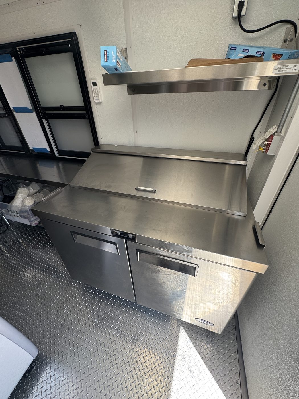 48 inch refrigerated sandwich prep table with stainless overshelf inside the roasted corn food truck