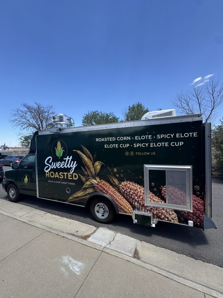 14ft Sweetly Roasted roasted corn food truck built for Lakewood, Colorado, street side showing the service window and menu wrap