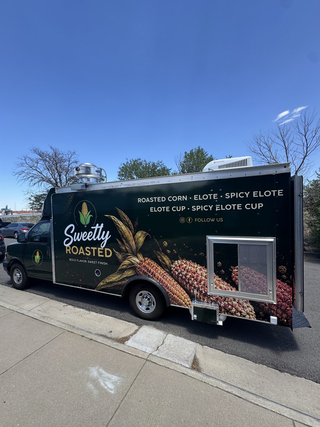 14ft Sweetly Roasted roasted corn food truck built for Lakewood, Colorado, street side showing the service window and menu wrap