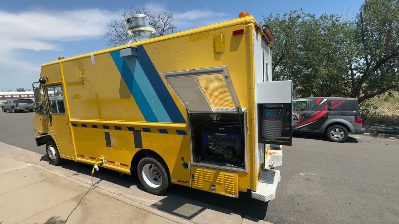 14ft smashburger food truck built on a Freightliner step van for Rapid City, South Dakota, street side with the service window open