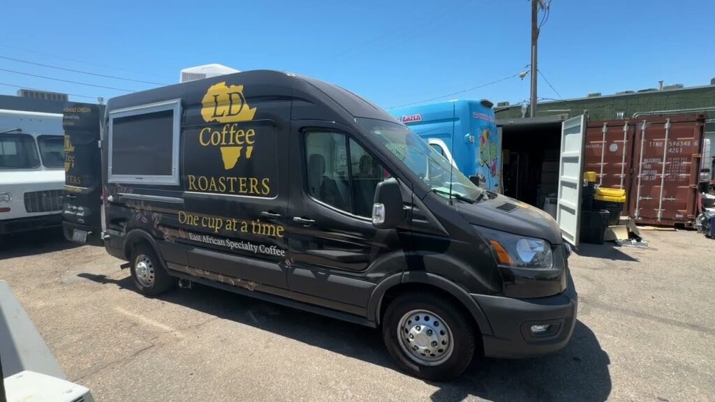 All electric coffee van built for a coffee roaster in Hastings, Nebraska, side view with the service doors open