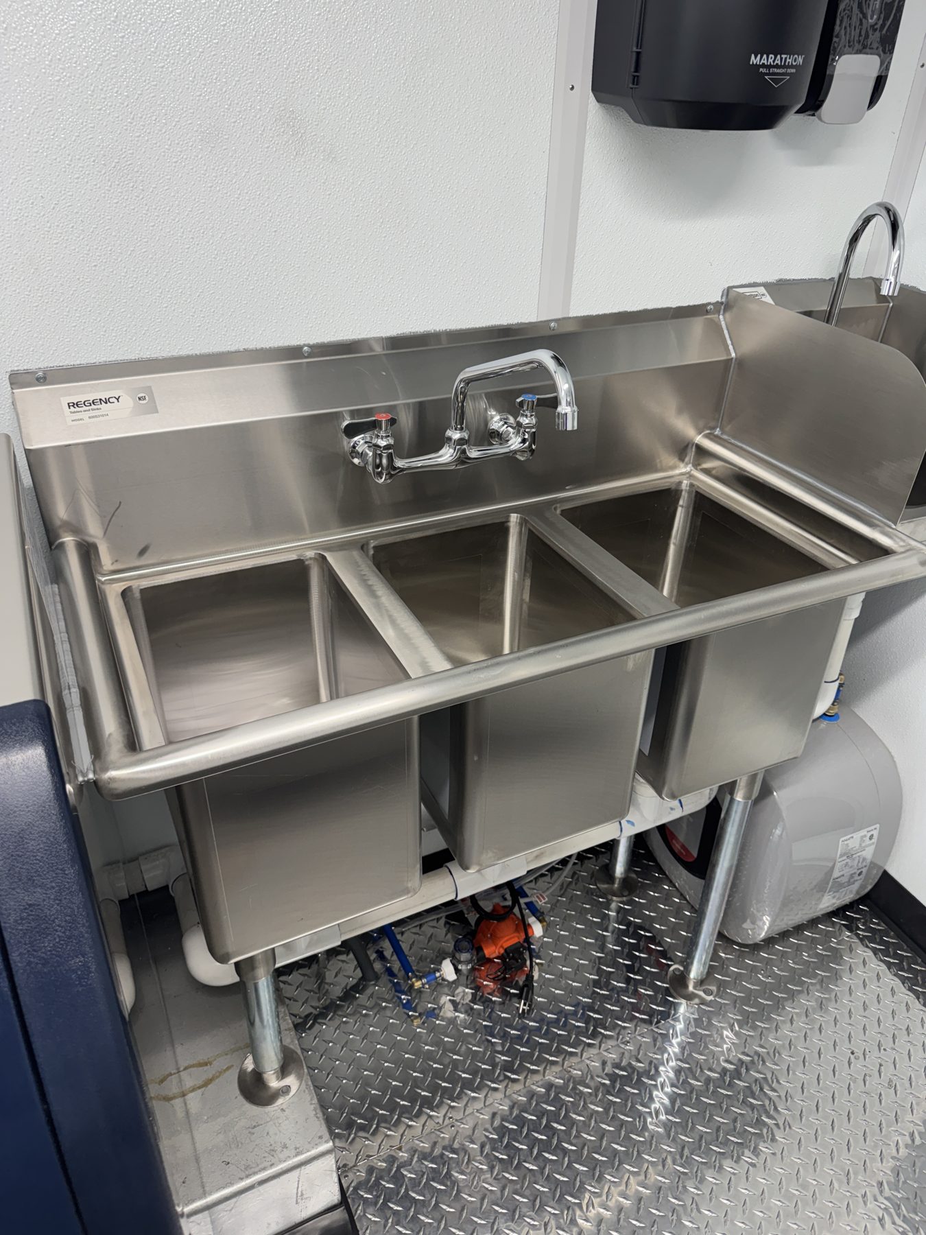 Three compartment sink with towel dispenser inside the boba tea truck