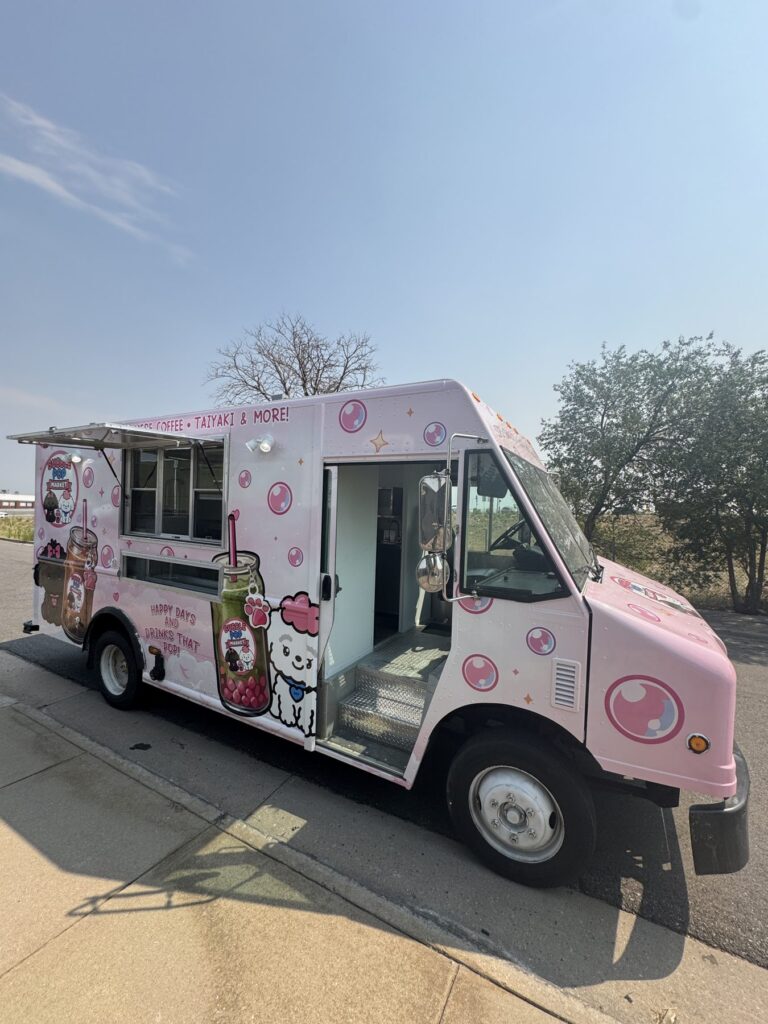 Pink 14ft boba tea food truck built for Bubble Pop Market in Fort Collins, Colorado, with the service window and door open