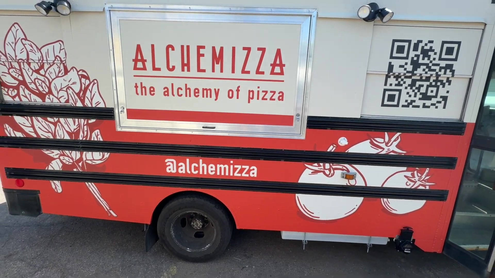 Alchemizza the alchemy of pizza wrap with a QR code on the side of the food bus