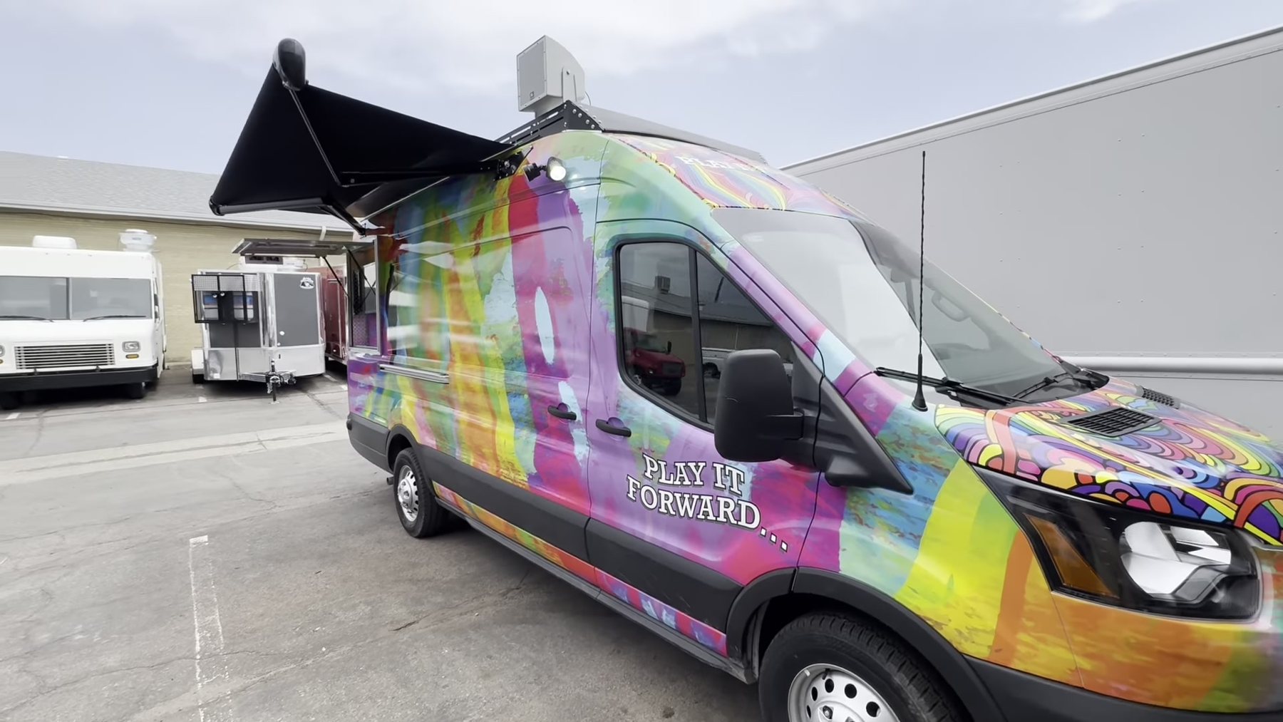 Ford Transit high roof mobile outreach van in the Play It Forward wrap built for Carson Tahoe Health in Nevada