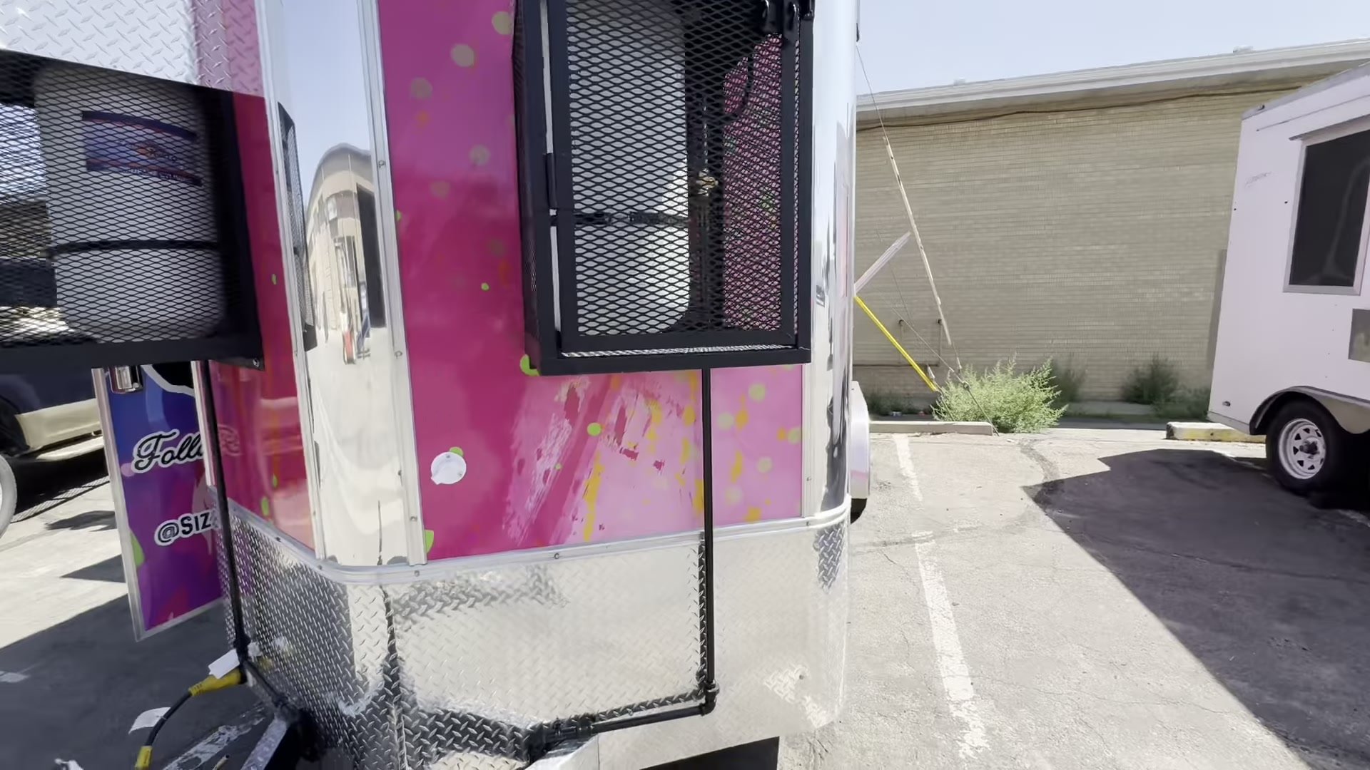 Lockable propane cages on the food trailer with a valve on each tank
