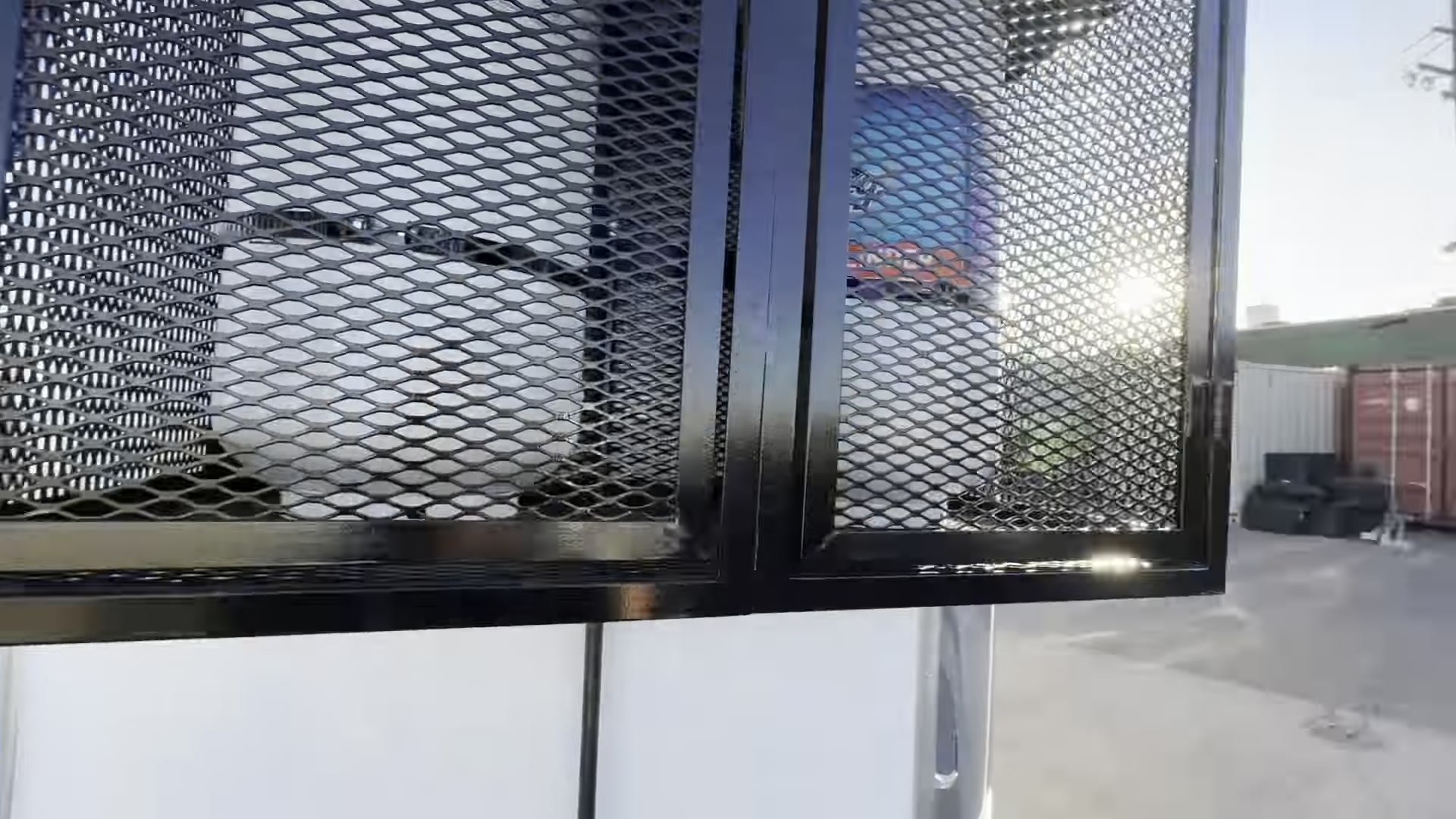 Propane tanks inside an expanded metal cage on the tongue of the food trailer