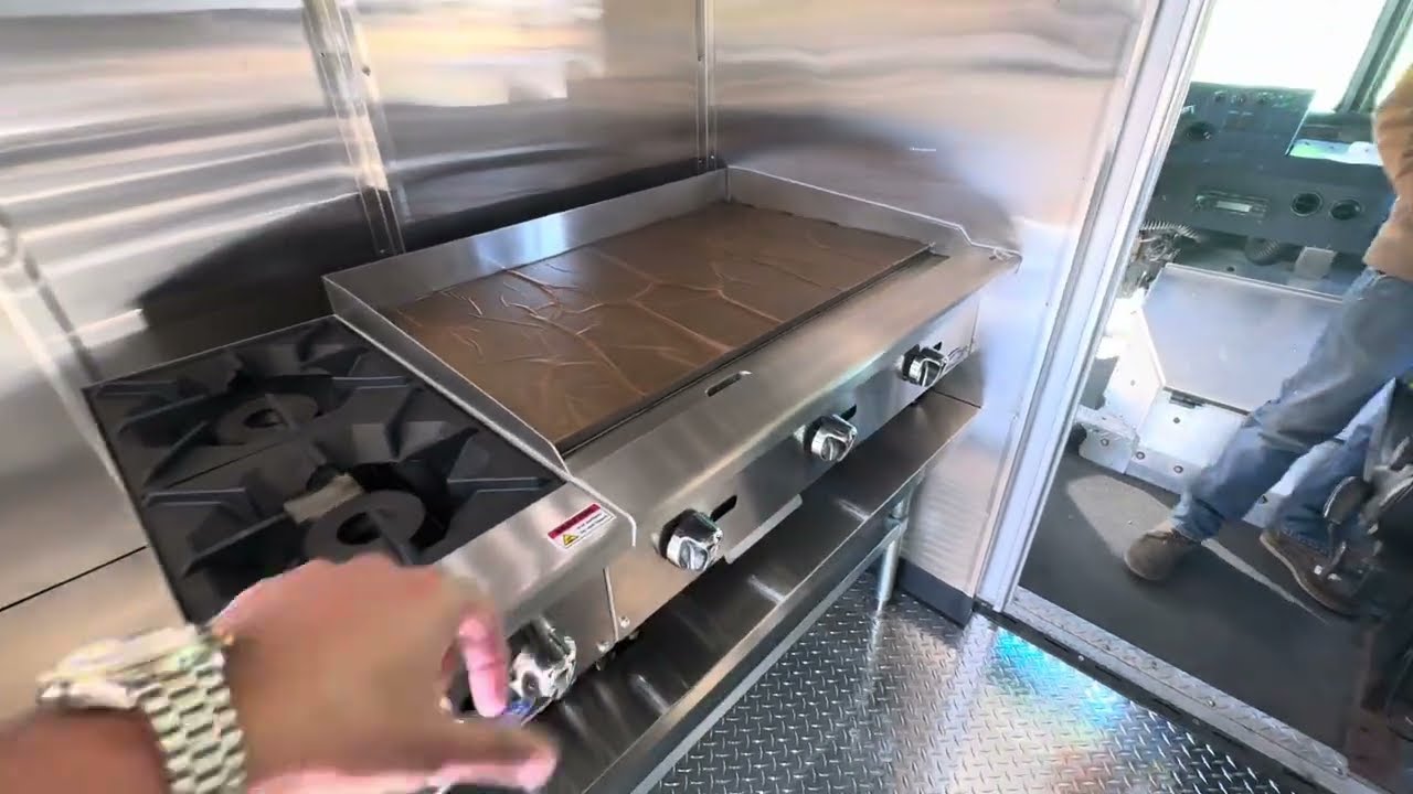 Griddle and range burners on the propane line inside a step van food truck