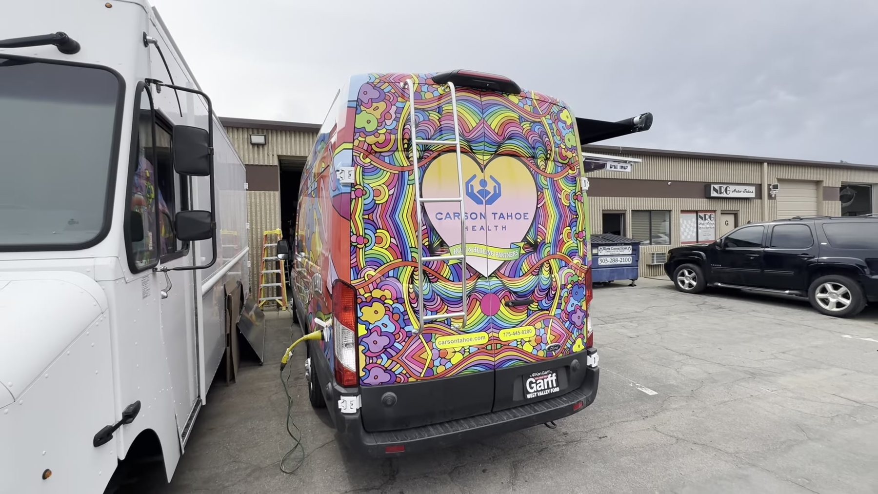 Rear of the outreach van showing the roof ladder and the Carson Tahoe Health graphic