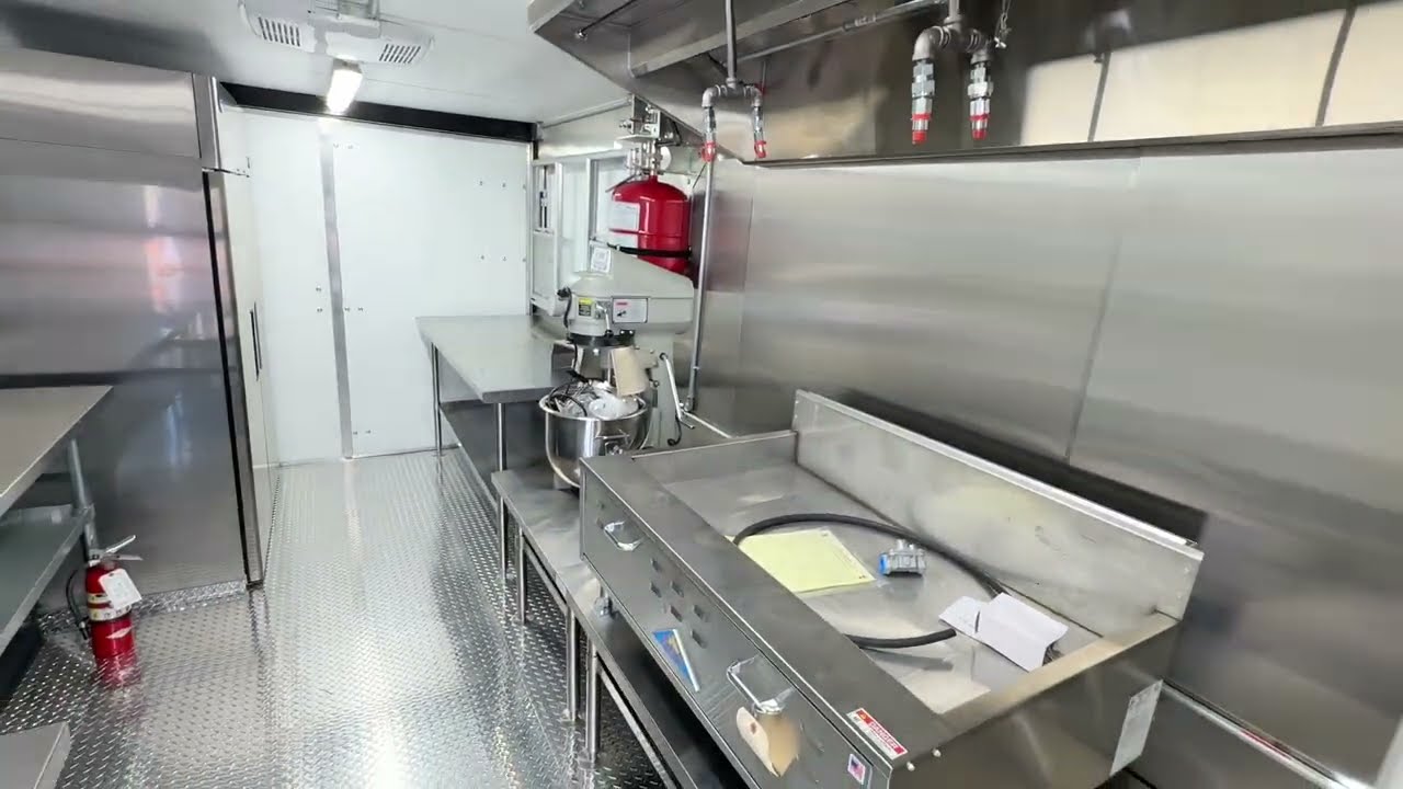 Inside the 20 foot sourdough donut trailer, sinks and prep line