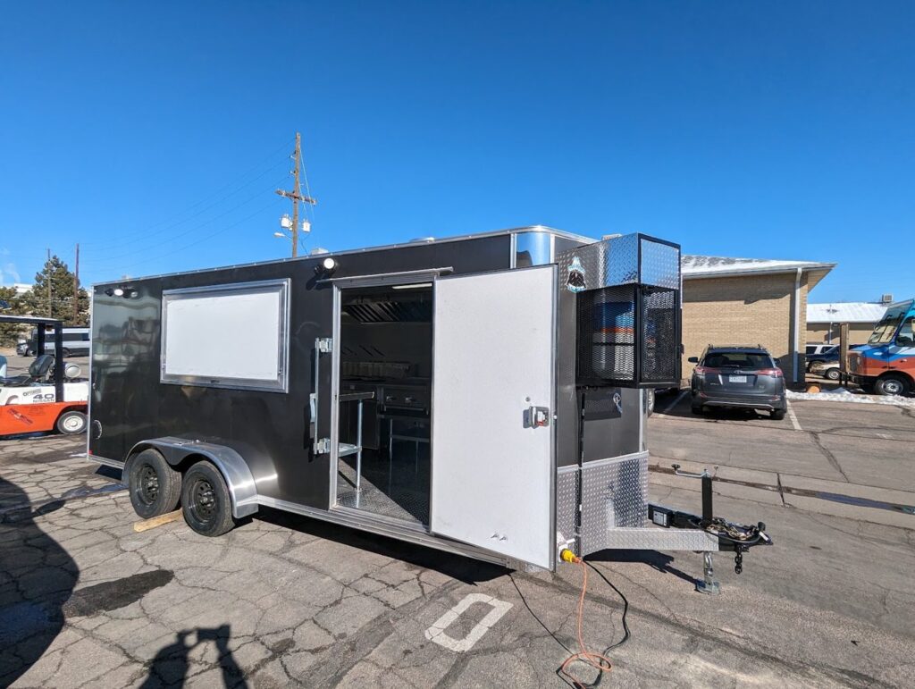 Eighteen foot grey tempura food trailer built for Ten Tempura, Lander, Wyoming, curb side